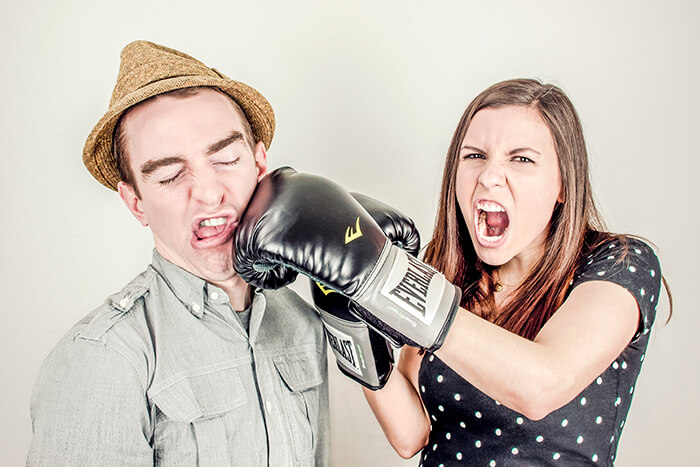 woman punching guy in the face