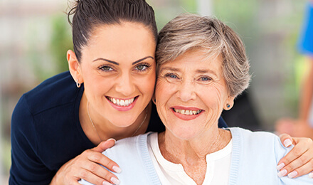 Two woman smiling